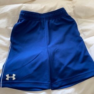 Boys Under Armour shorts size five. Blue.